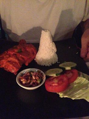 Chicken with a cone of rice